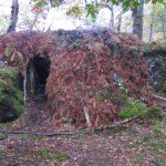 Here a thick layer of bracken has been laid over the heather - the stems last quite a long time, and add to the water resiliency of the shelter walls. Here a thick layer of bracken has been laid over the heather - the stems last quite a long time, and add to the water resiliency of the shelter walls.